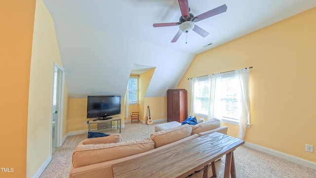 8042 Hogan Dr, Wake Forest, NC 27587 - living area featuring vaulted ceiling, light carpet, baseboards, and a ceiling fan