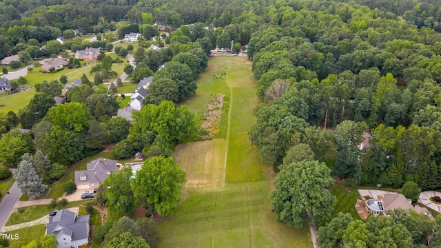 8042 Hogan Dr, Wake Forest, NC 27587 - aerial view of property and surrounding area featuring nearby suburban area and a heavily wooded area