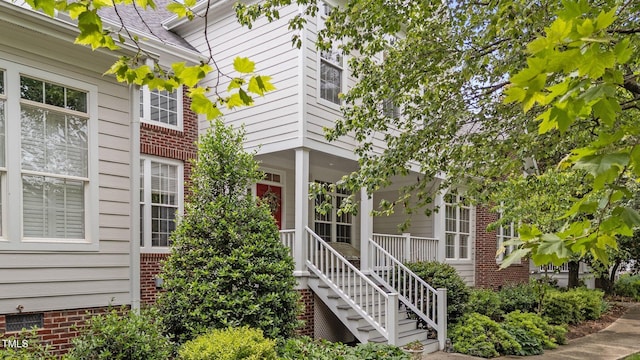 3923 Napa Valley Dr, Raleigh, NC 27612 - entrance to property featuring covered porch and brick siding