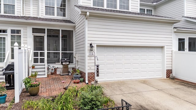 3923 Napa Valley Dr, Raleigh, NC 27612 - entrance to property with an attached garage, concrete driveway, and a shingled roof
