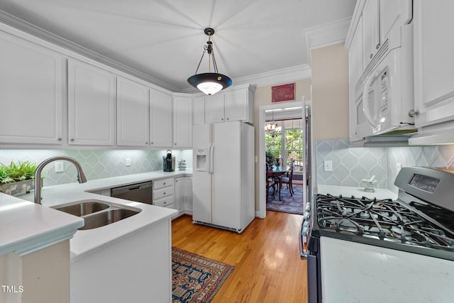 3923 Napa Valley Dr, Raleigh, NC 27612 - kitchen with appliances with stainless steel finishes, a sink, white cabinetry, tasteful backsplash, and ornamental molding