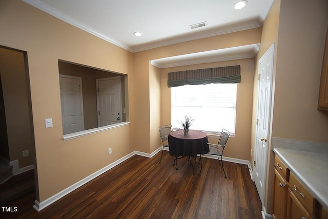 dining room with dark wood finished floors, baseboards, ornamental molding, and recessed lighting