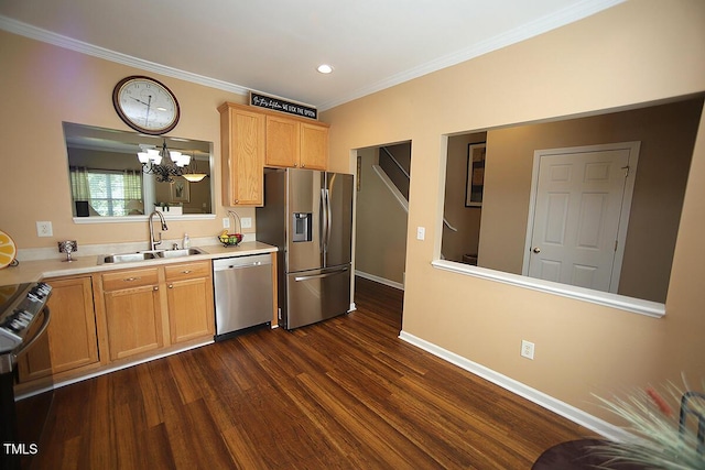 kitchen featuring appliances with stainless steel finishes, a sink, a chandelier, ornamental molding, and dark wood finished floors