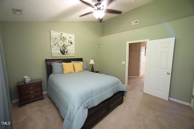 bedroom featuring light carpet, vaulted ceiling, baseboards, and ceiling fan