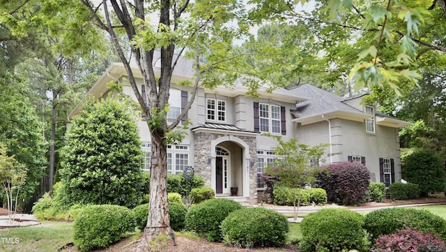 17832 Durrango Ct, Charlotte, NC 28278 - view of front of home featuring stone siding, stucco siding, and roof with shingles