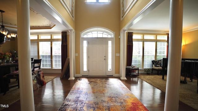 17832 Durrango Ct, Charlotte, NC 28278 - entryway featuring ornate columns, ornamental molding, a chandelier, and healthy amount of natural light