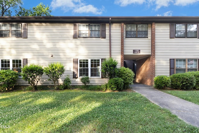 1208 Manassas Ct Unit A, Raleigh, NC 27609 - townhome / multi-family property with a front lawn