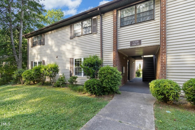 1208 Manassas Ct Unit A, Raleigh, NC 27609 - view of side of property featuring a yard