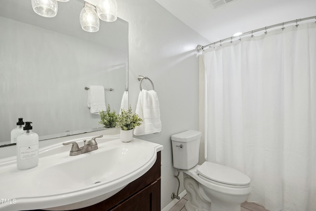 1208 Manassas Ct Unit A, Raleigh, NC 27609 - bathroom with toilet, vanity, and curtained shower