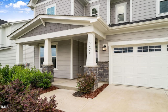 5420 Mill Dam Rd, Wake Forest, NC 27587 - entrance to property featuring a porch, an attached garage, and stone siding