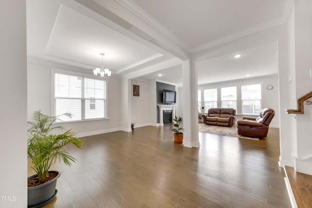 5420 Mill Dam Rd, Wake Forest, NC 27587 - living area featuring a chandelier, crown molding, a fireplace, dark wood finished floors, and a tray ceiling