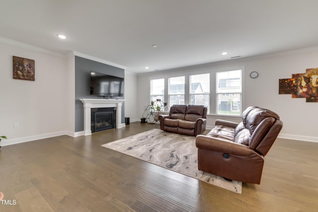 5420 Mill Dam Rd, Wake Forest, NC 27587 - living room with crown molding, baseboards, wood finished floors, recessed lighting, and a glass covered fireplace
