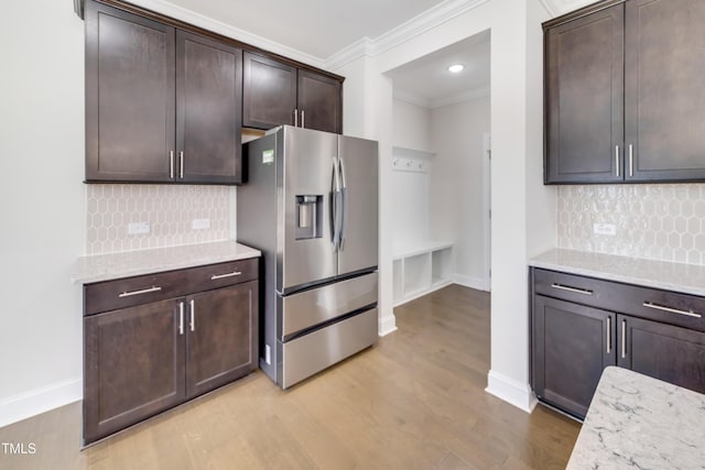 5420 Mill Dam Rd, Wake Forest, NC 27587 - kitchen featuring stainless steel refrigerator with ice dispenser, crown molding, dark brown cabinets, light wood-style flooring, and decorative backsplash