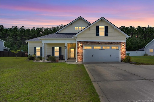 213 Windwood Dr, Stedman, NC 28391 - view of front of home featuring covered porch, concrete driveway, and an attached garage