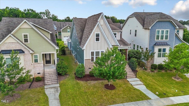 2837 Milano Ave, Apex, NC 27502 - view of front of home with stairs, board and batten siding, brick siding, and a front lawn