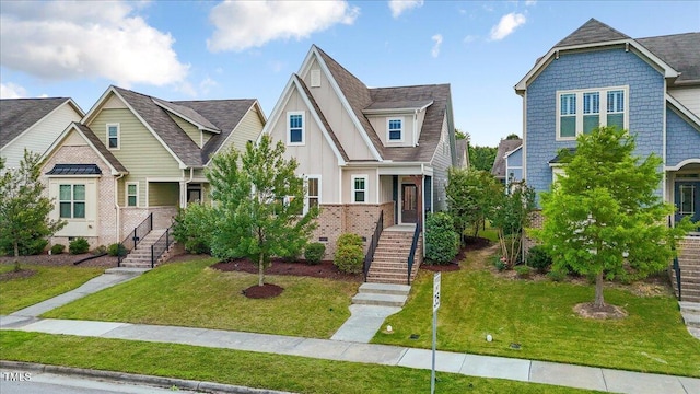 2837 Milano Ave, Apex, NC 27502 - view of front of house with stairway, board and batten siding, a front yard, and roof with shingles