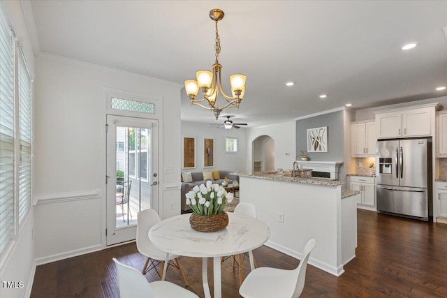 2837 Milano Ave, Apex, NC 27502 - dining area featuring a chandelier, ornamental molding, recessed lighting, dark wood-style flooring, and a ceiling fan