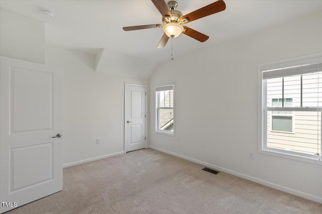 2837 Milano Ave, Apex, NC 27502 - unfurnished bedroom with light carpet, baseboards, lofted ceiling, and a ceiling fan