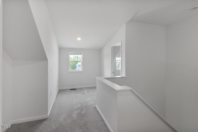 2837 Milano Ave, Apex, NC 27502 - hall with an upstairs landing, carpet, baseboards, vaulted ceiling, and recessed lighting