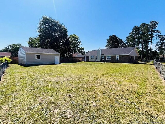 7690 Beverly Dr, Fayetteville, NC 28314 - view of yard with an outbuilding
