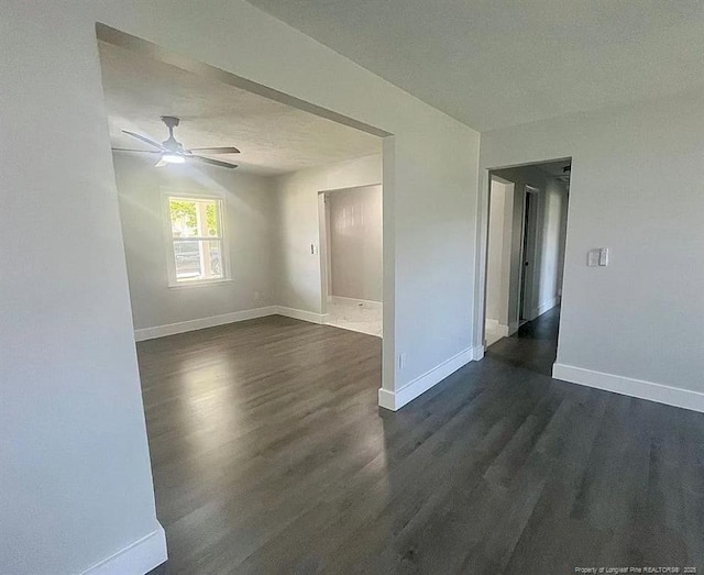 7690 Beverly Dr, Fayetteville, NC 28314 - unfurnished room featuring dark wood-style floors, baseboards, and ceiling fan