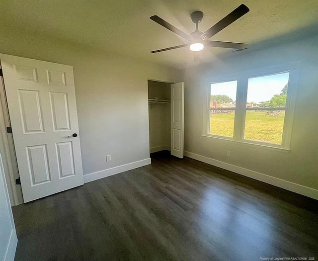 7690 Beverly Dr, Fayetteville, NC 28314 - unfurnished bedroom featuring baseboards, a closet, and dark wood-style floors