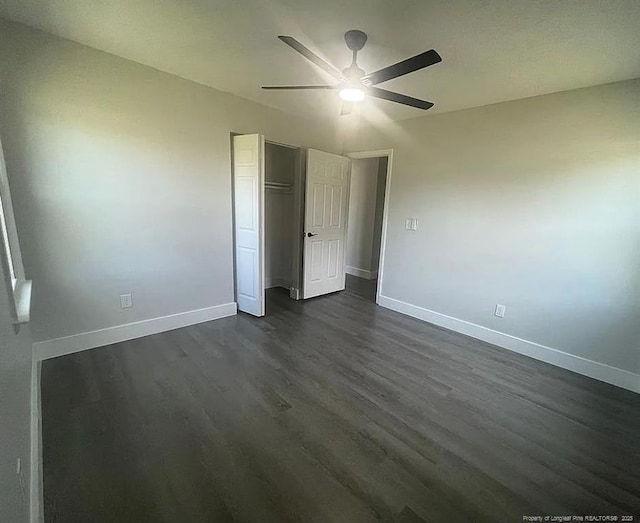 7690 Beverly Dr, Fayetteville, NC 28314 - unfurnished bedroom featuring baseboards, dark wood finished floors, a closet, and ceiling fan