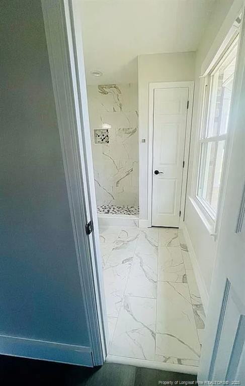 7690 Beverly Dr, Fayetteville, NC 28314 - hallway featuring light marble finish floors