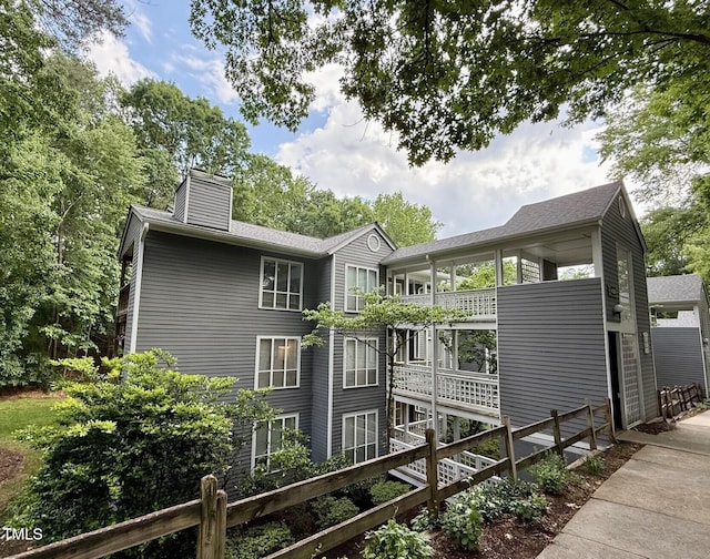 4120 Sedgewood Dr Unit 106, Raleigh, NC 27612 - view of home's exterior featuring a chimney