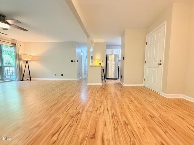 4120 Sedgewood Dr Unit 106, Raleigh, NC 27612 - unfurnished living room with light wood-style flooring, ceiling fan, and baseboards