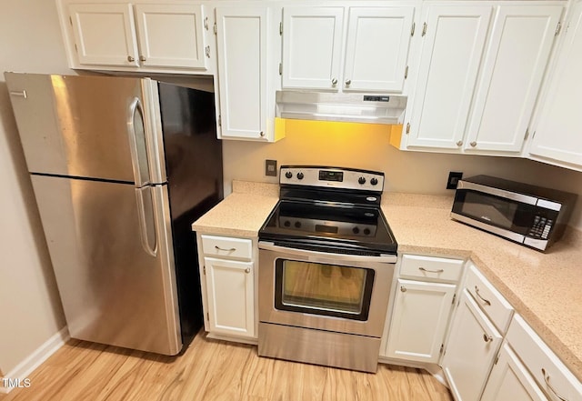 4120 Sedgewood Dr Unit 106, Raleigh, NC 27612 - kitchen featuring stainless steel appliances, under cabinet range hood, light wood-style floors, white cabinets, and light countertops