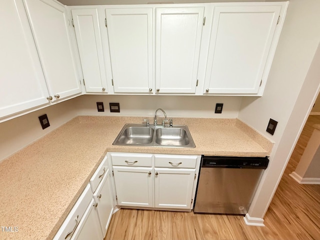4120 Sedgewood Dr Unit 106, Raleigh, NC 27612 - kitchen with dishwasher, a sink, light wood-type flooring, and white cabinetry