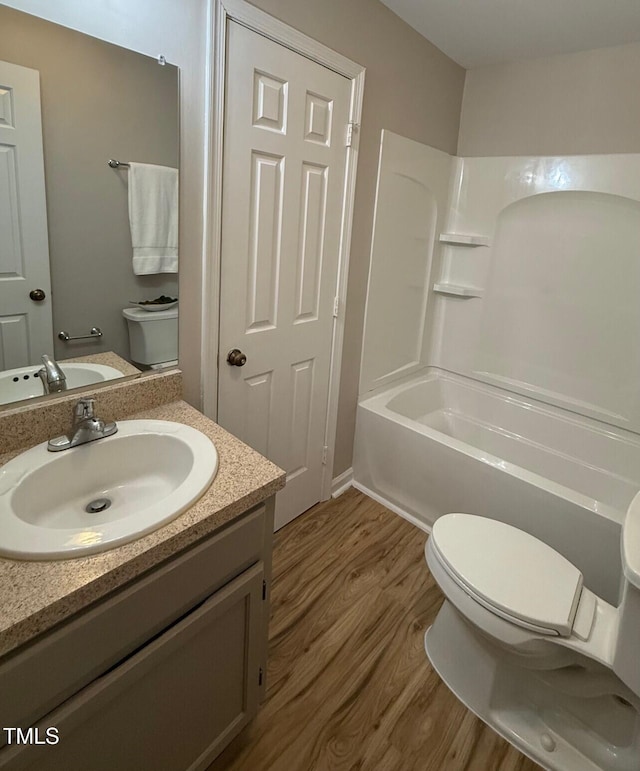 4120 Sedgewood Dr Unit 106, Raleigh, NC 27612 - full bath with toilet, wood finished floors, and vanity