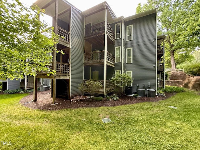 4120 Sedgewood Dr Unit 106, Raleigh, NC 27612 - rear view of property featuring a yard and central AC unit