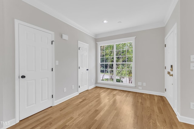 2204 Bellaire Ave, Raleigh, NC 27608 - entryway featuring ornamental molding, baseboards, light wood-type flooring, and recessed lighting