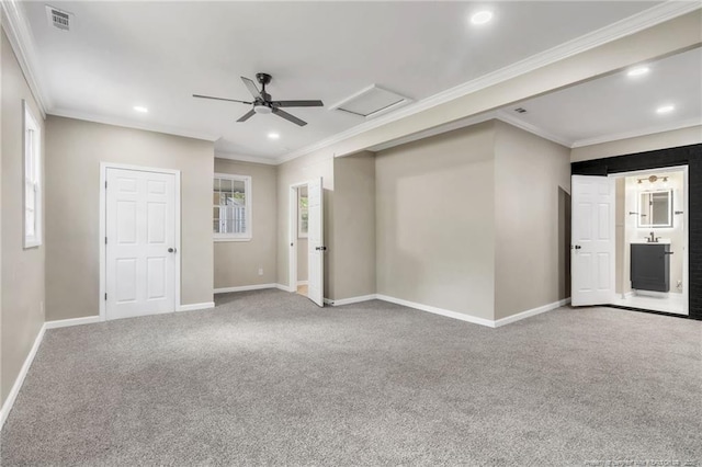 empty room featuring attic access, ornamental molding, recessed lighting, carpet flooring, and baseboards