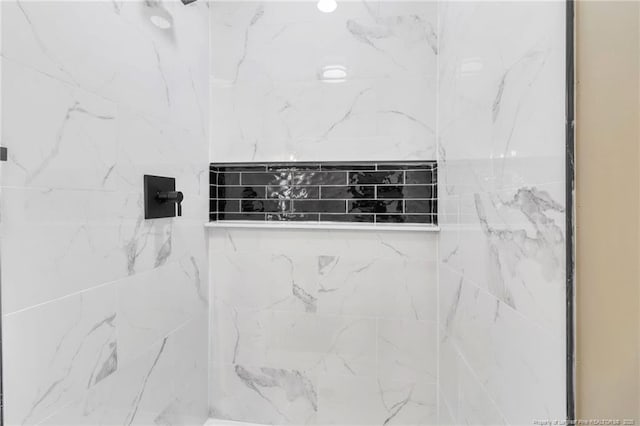 bathroom view of tiled shower