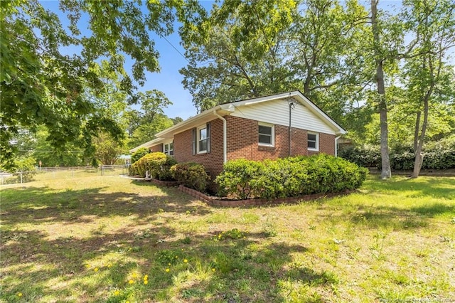 view of property exterior with brick siding