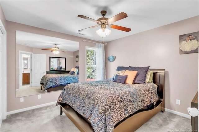 carpeted bedroom with baseboards and a ceiling fan