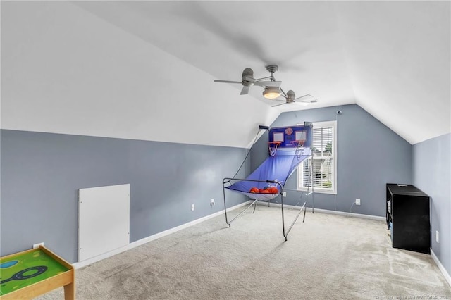 rec room featuring lofted ceiling, carpet, baseboards, and a ceiling fan