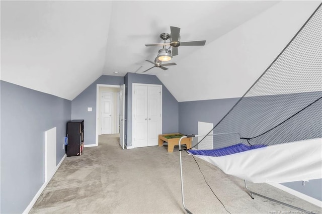 bonus room featuring carpet floors, a ceiling fan, vaulted ceiling, and baseboards