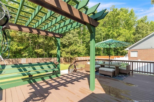 deck with a fenced backyard, a pergola, and an outdoor living space