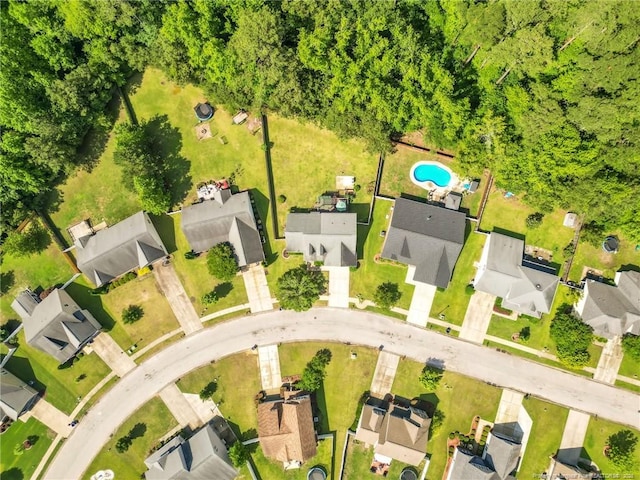 aerial view of residential area featuring a pool