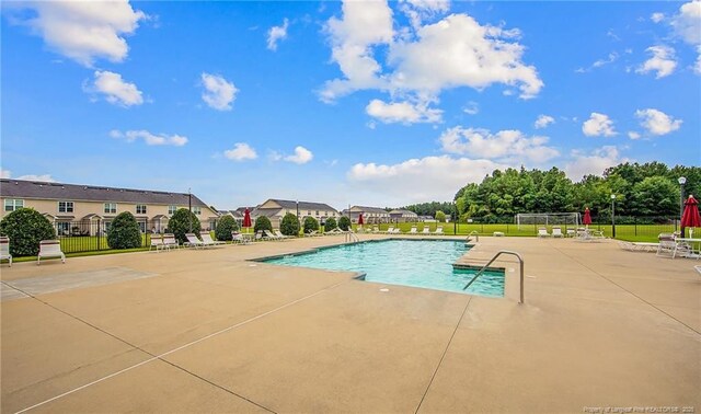 community pool with a patio