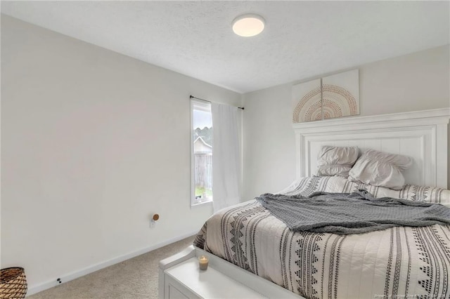 5008 Shimmer Dr, Fayetteville, NC 28304 - carpeted bedroom with baseboards and a textured ceiling