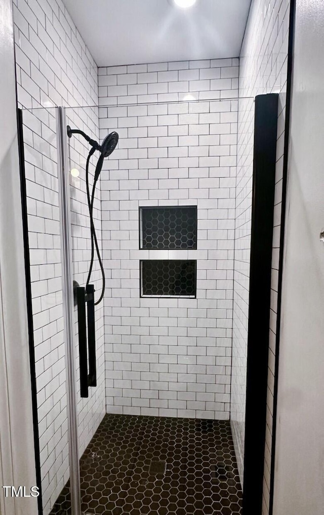 bathroom with a shower stall