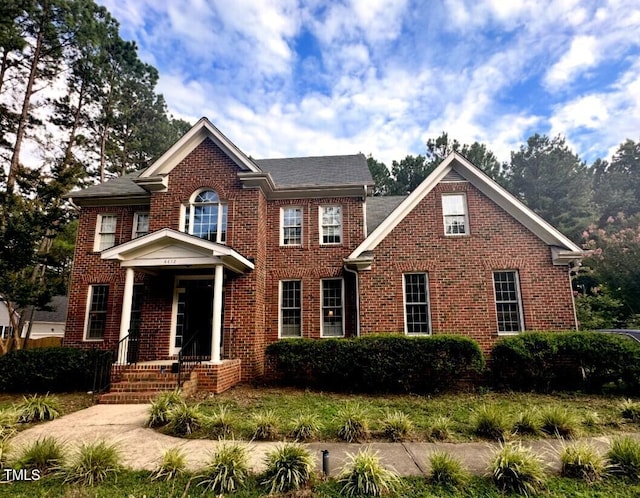 colonial house with brick siding