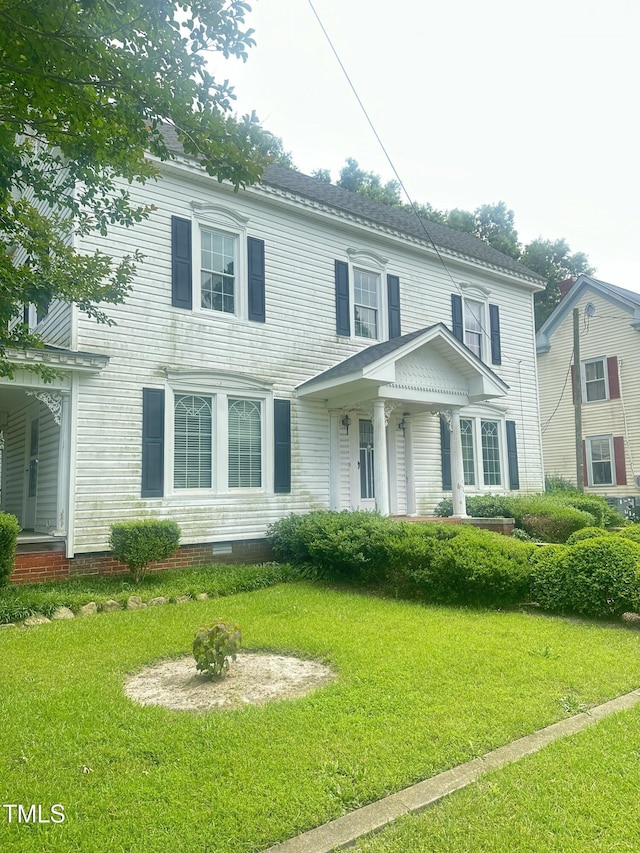 112 E Sycamore St, Zebulon, NC 27597 - view of front of house with a front yard and crawl space