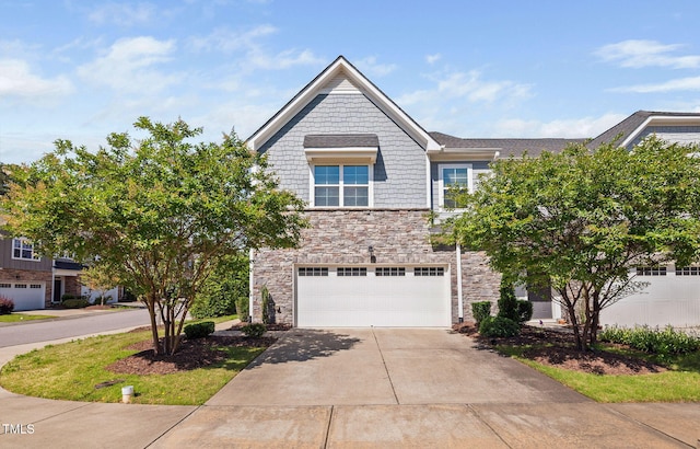 1103 Laurel Twist Rd, Cary, NC 27513 - view of front of home featuring concrete driveway, stone siding, and a garage