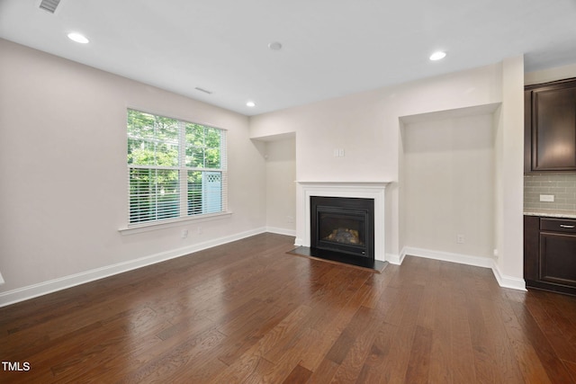 1103 Laurel Twist Rd, Cary, NC 27513 - unfurnished living room featuring dark wood finished floors, a fireplace with flush hearth, recessed lighting, and baseboards